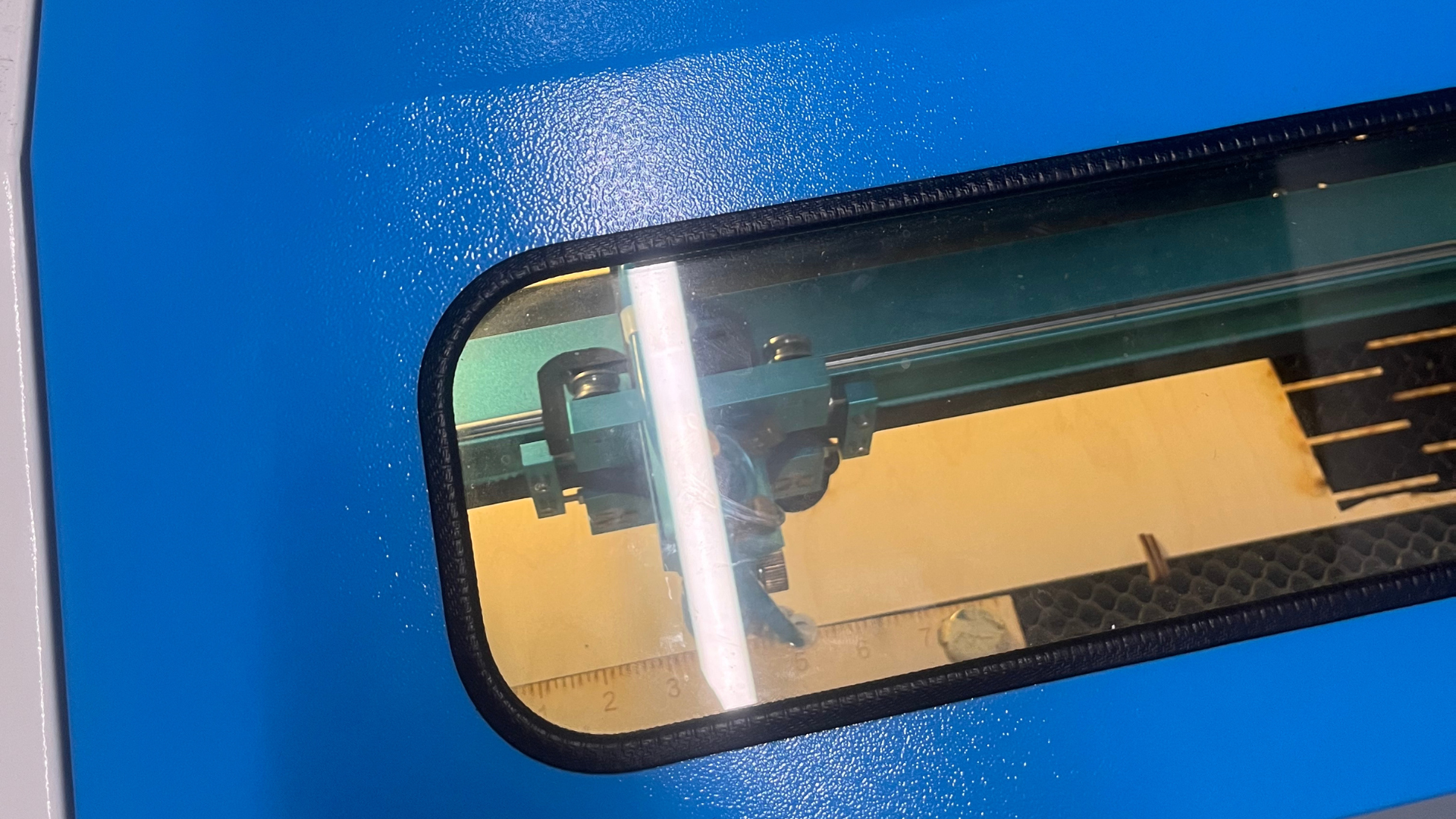 This photo was taken during our class visit to the laser engraving lab with Steve. I captured a close-up shot of the laser machine. It shows the interior of the printer.