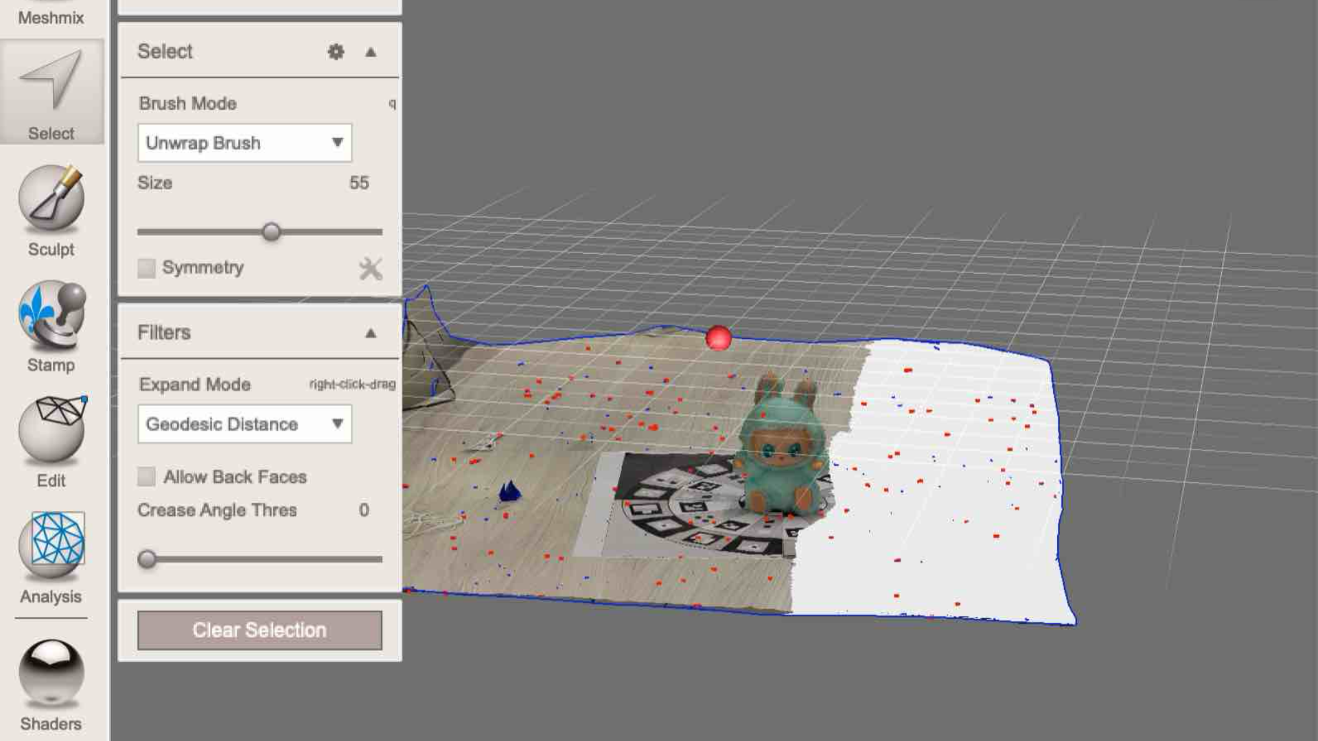 This screenshot shows the process of selecting and deleting unwanted floor pieces in Meshmixer. I used the selection brush to highlight extra geometry before removing it.