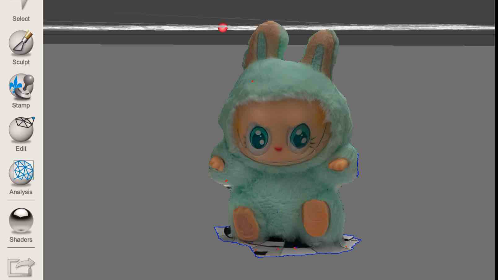 This image shows the bunny plushie scan inside Meshmixer after removing most of the floor. The outline of the plushie is still rough, but the main form is now isolated.
