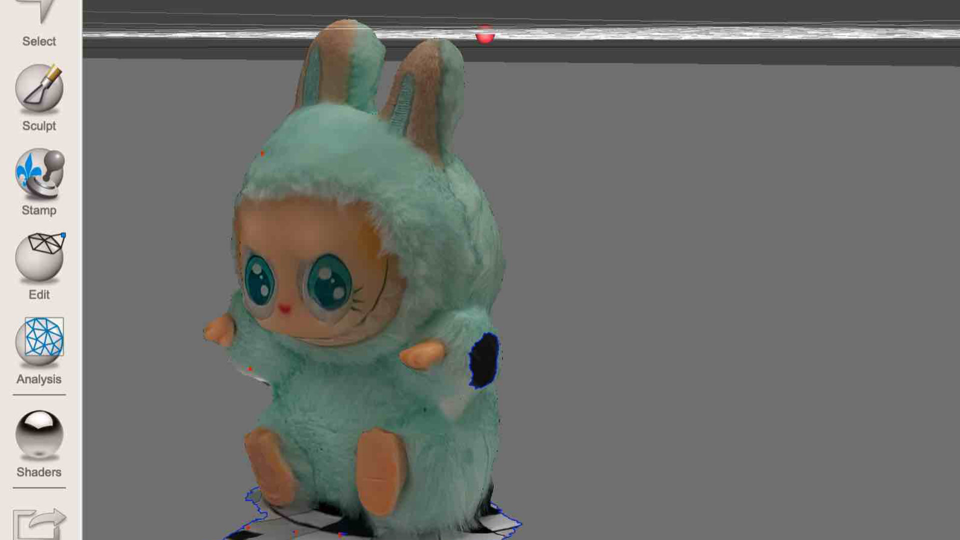 This image shows the side of the bunny plushie scan while continuing to clean extra mesh. Some holes and missing parts are still visible on the side of the model.