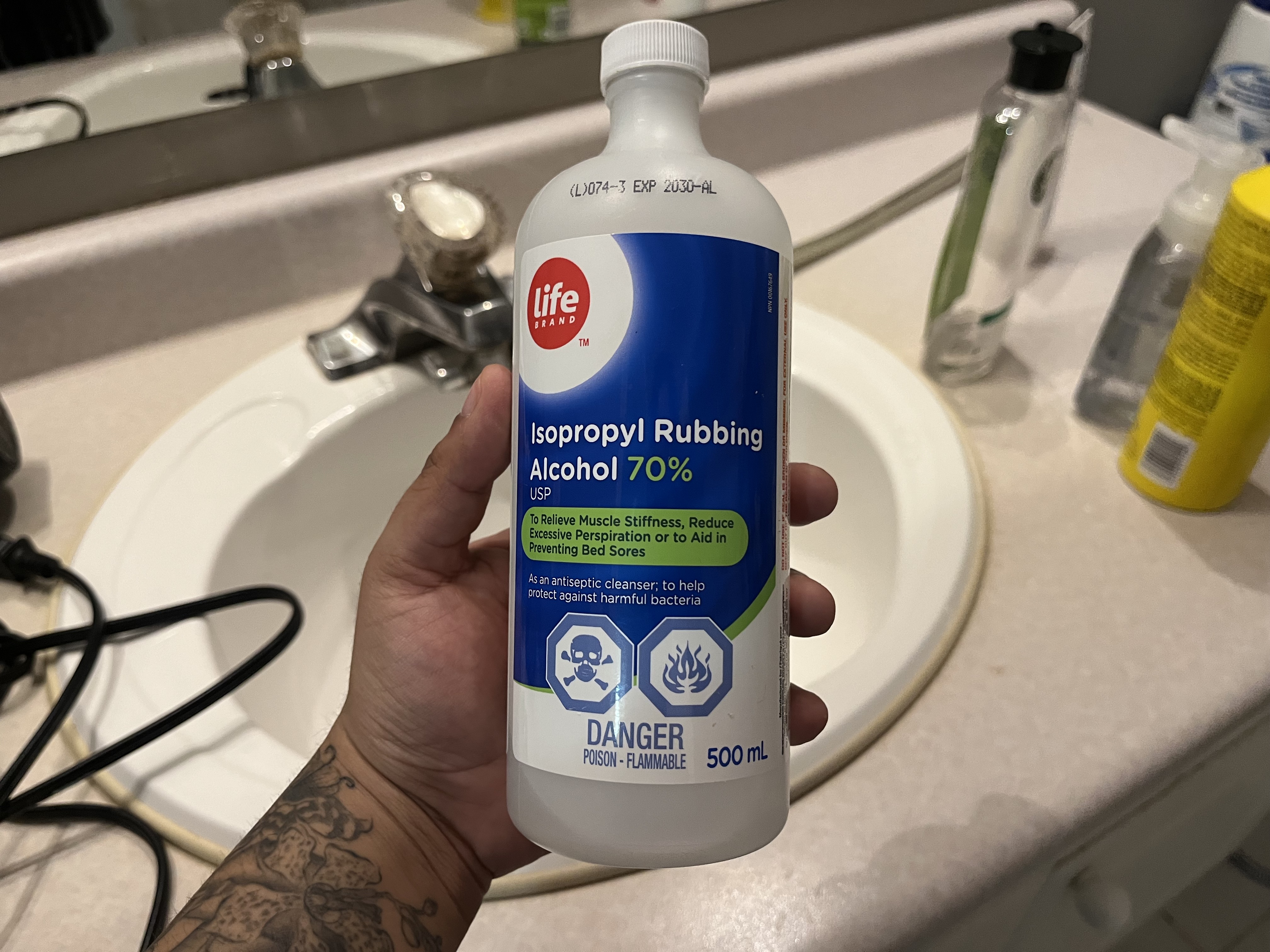 This is the sound of the bottle being shaken up and down, with the liquid inside swishing around.