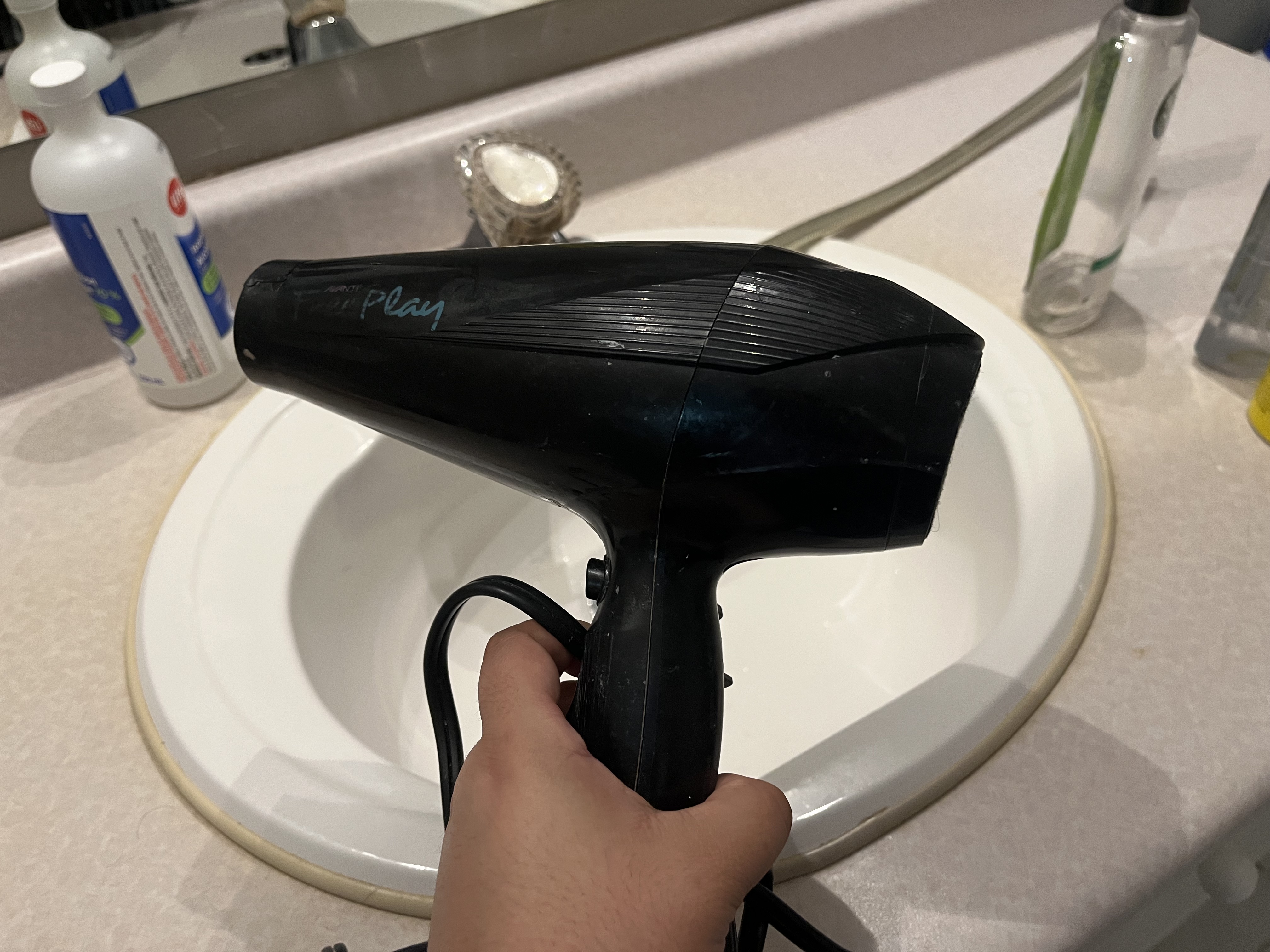 This is the sound of a blow dryer being turned on at its highest setting and then shut off, starting with a loud burst of air followed by a quick stop.