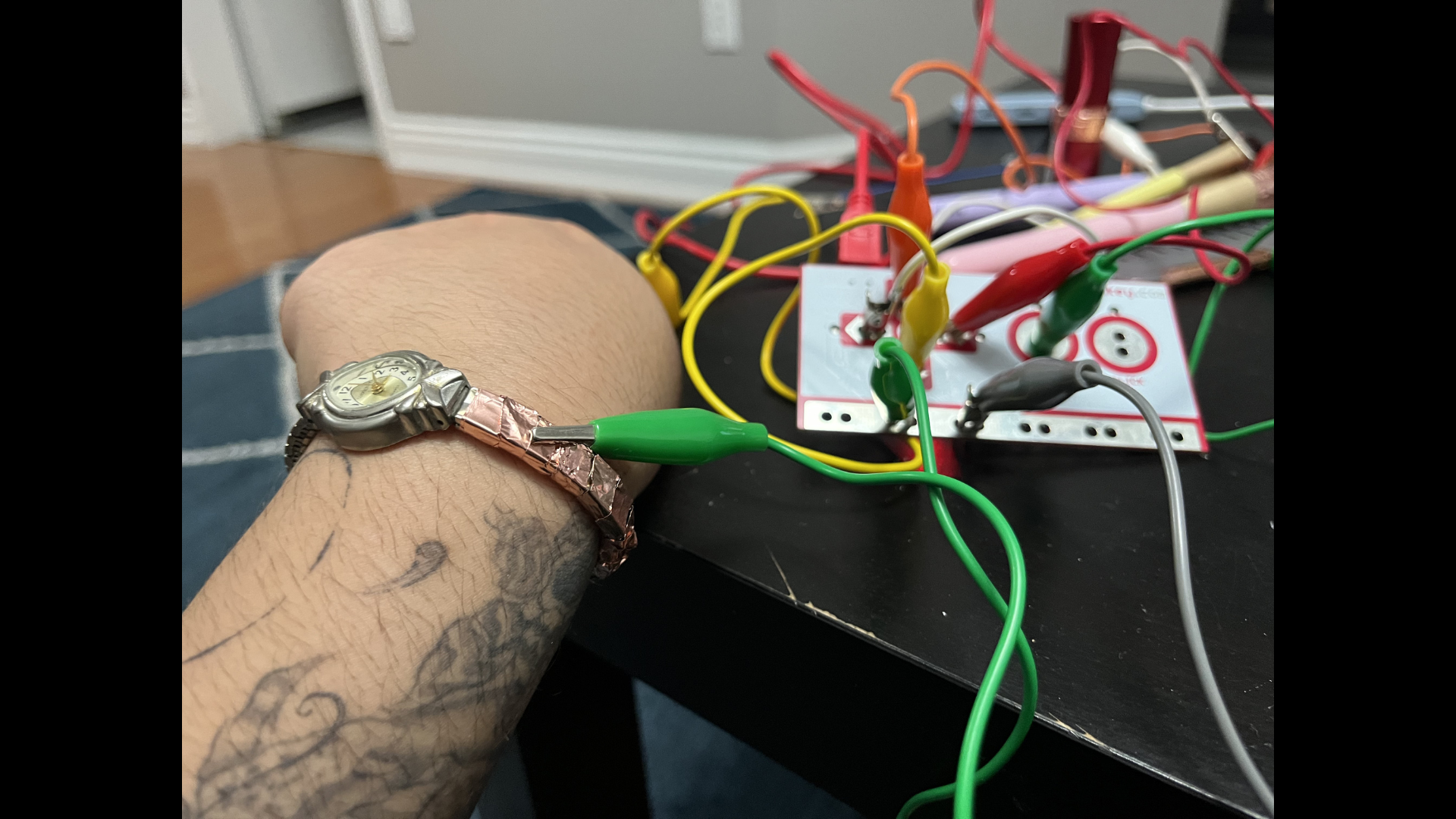 This is the watch. I added more conductive tape and connected it using the green wire.
